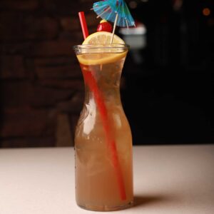 Mariposas Long Island cocktail served tall over ice with a fresh lemon garnish.