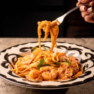 Mariposas Pasta A La Diabla: shrimp, creamy chipotle sauce, cotija, chili flakes, garlic bread.