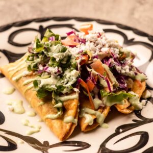 Mariposas Taquitos: 3 Crispy tacos, romaine & cabbage mix, cream, queso fresco.